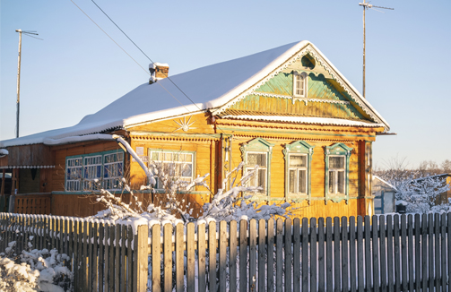 house in the winter covered in snow