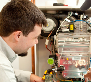 man working on a heating system