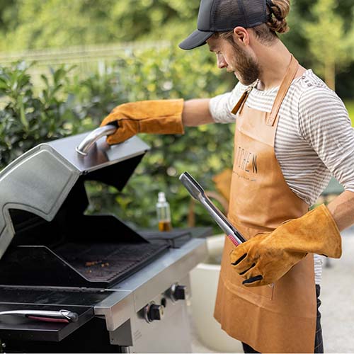 man cooking on a grill